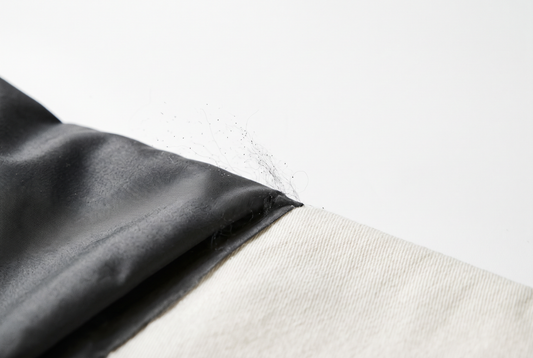 Synthetic textile fibres shown as an invisible pollution concept